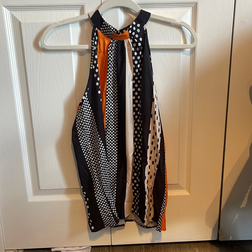 Bought on line and cannot return.  Cute- sleeveless top- brand new.  4-6